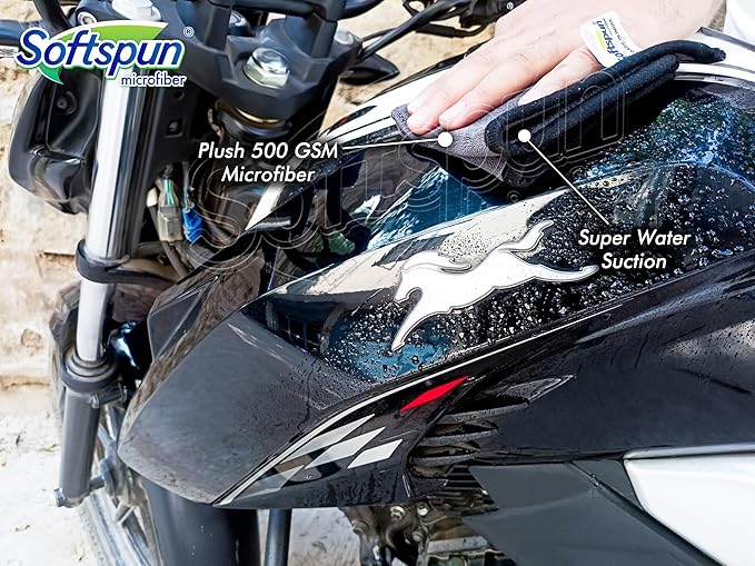 Motorcycle with a Softspun microfiber cover being applied, highlighting features like plush 500 GSM microfiber and super water suction.