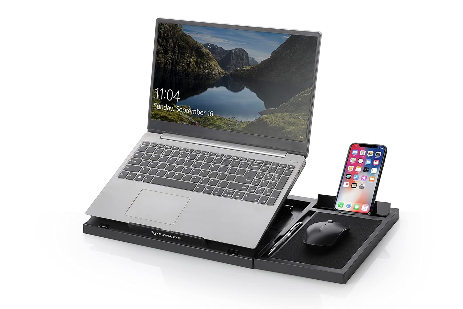 Laptop on a stand with smartphone and mouse on a white background