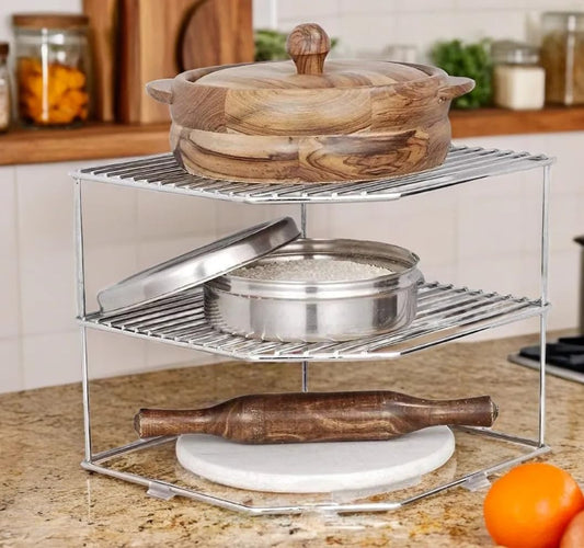 Metal kitchen organizer with wooden and metal items on a countertop