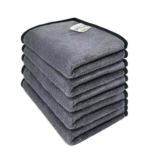 Stack of gray microfiber towels on a white background
