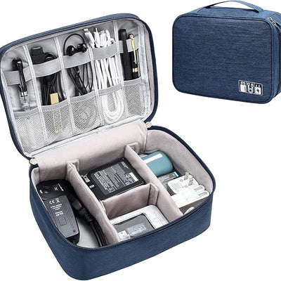 Blue travel organizer with compartments filled with electronic accessories on a white background