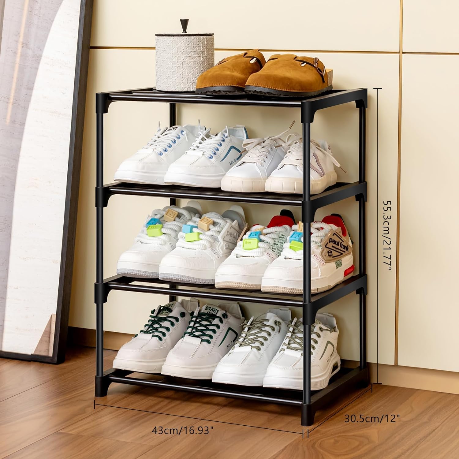 Black shoe rack with various shoes on a wooden floor.