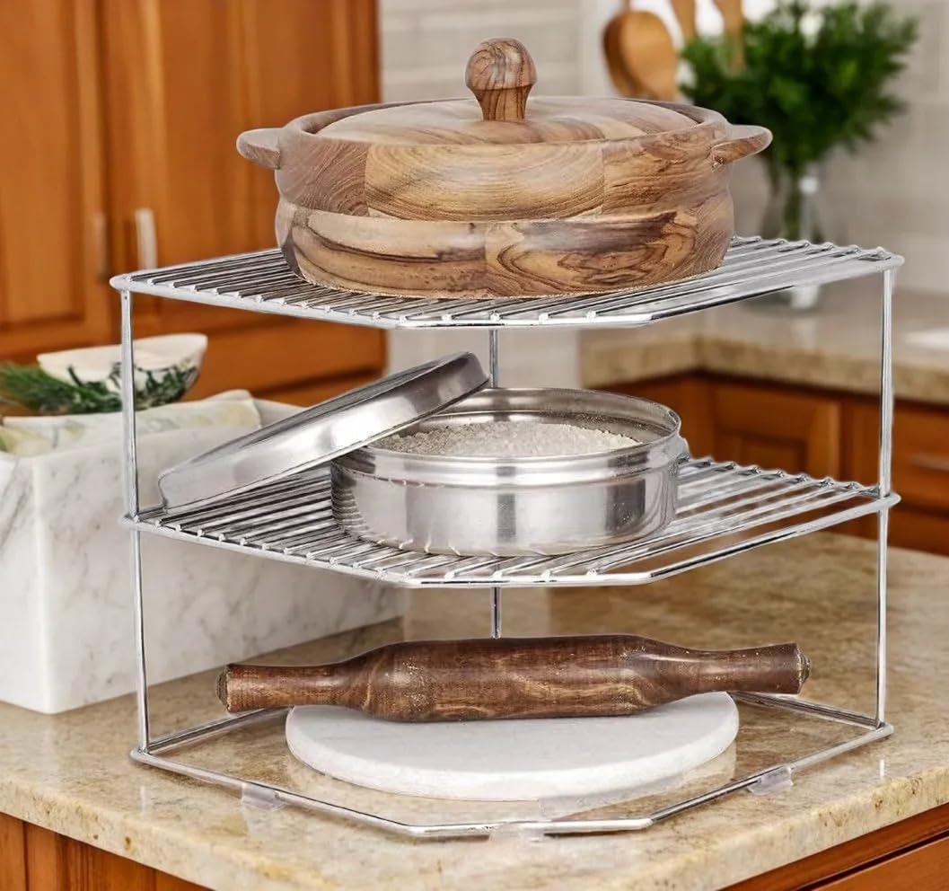 Three-tier metal kitchen organizer with wooden and metallic pots and pans on a countertop.